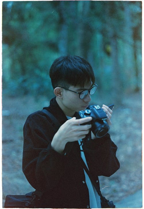亞洲男性, 單反相機, 垂直拍攝 的 免費圖庫相片