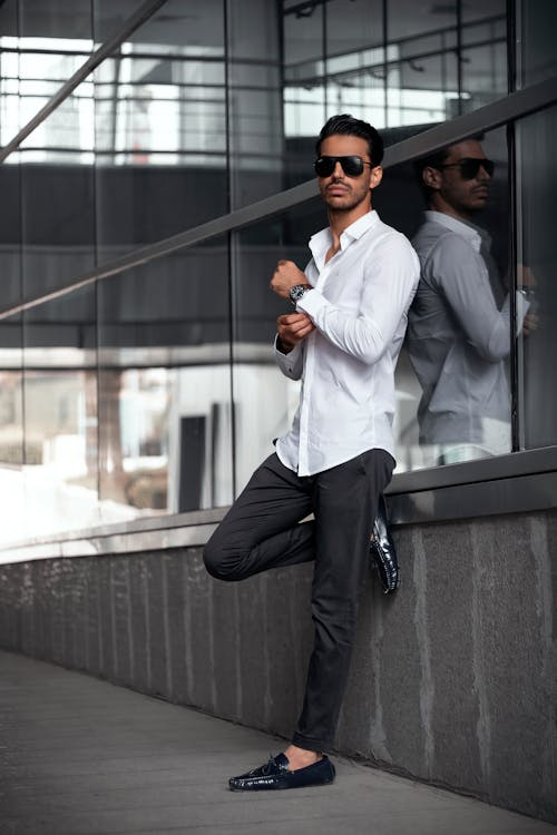 Man in White Long Sleeve Shirt Standing Beside Glass Window · Free ...