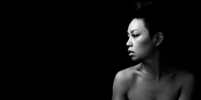 Portrait of a young woman in warm light — photo by Evelyn Chong on Pexels