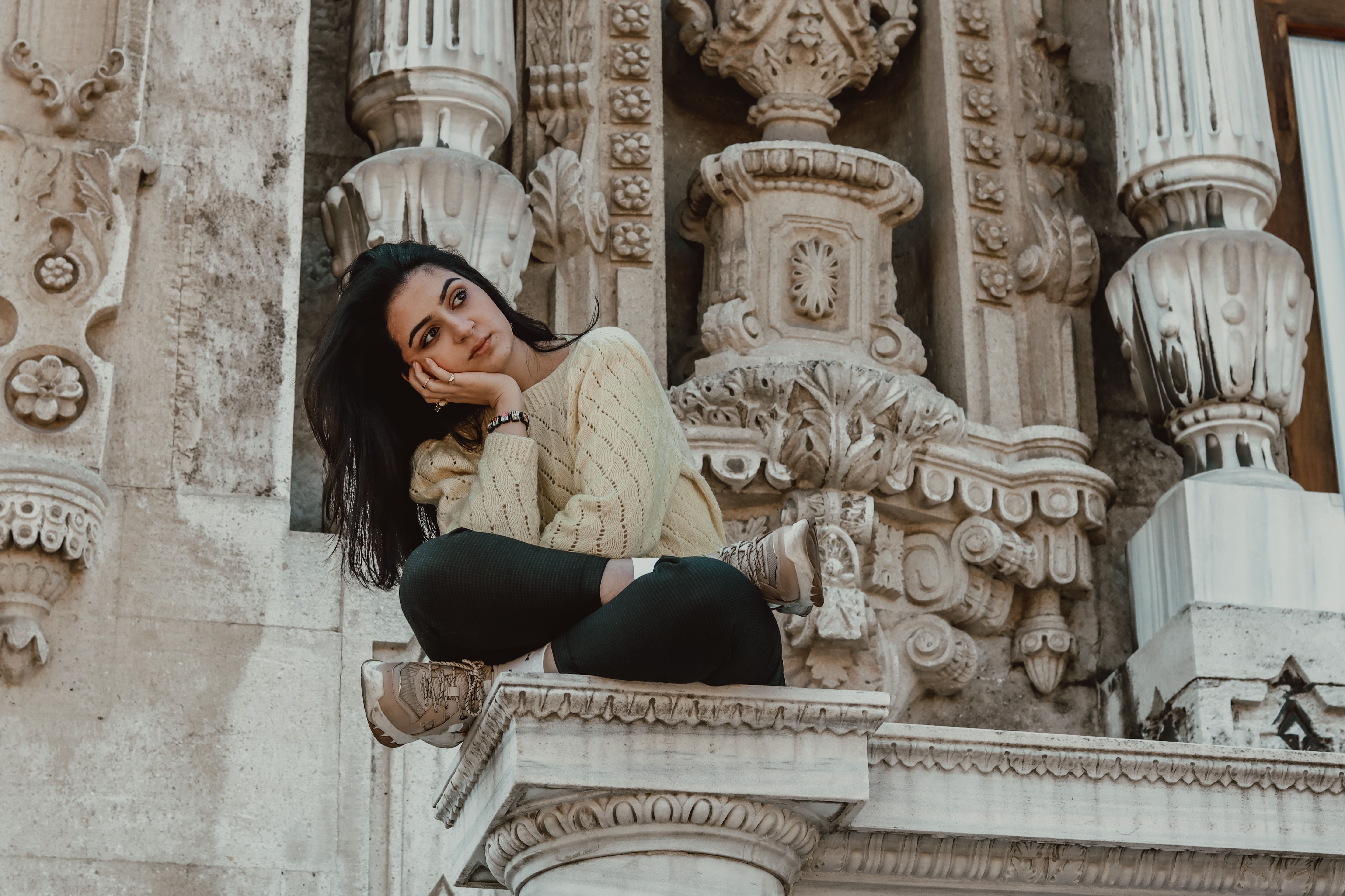 A Woman in Beige Sweater Sitting · Free Stock Photo