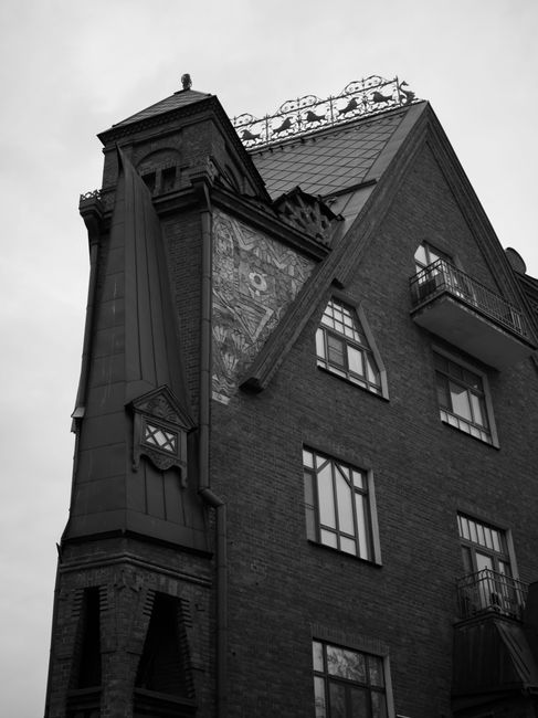 Grayscale image of a historic building in Moscow with detailed architecture.