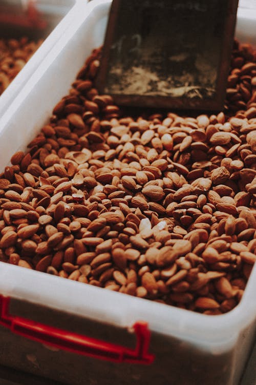 Free Almond Nuts in a Plastic Container Stock Photo
