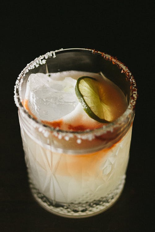 Close-Up Photo of a Cocktail Drink with a Slice of Lime