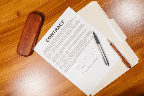 Signed release agreement attached to the task — photo by RDNE Stock project on Pexels