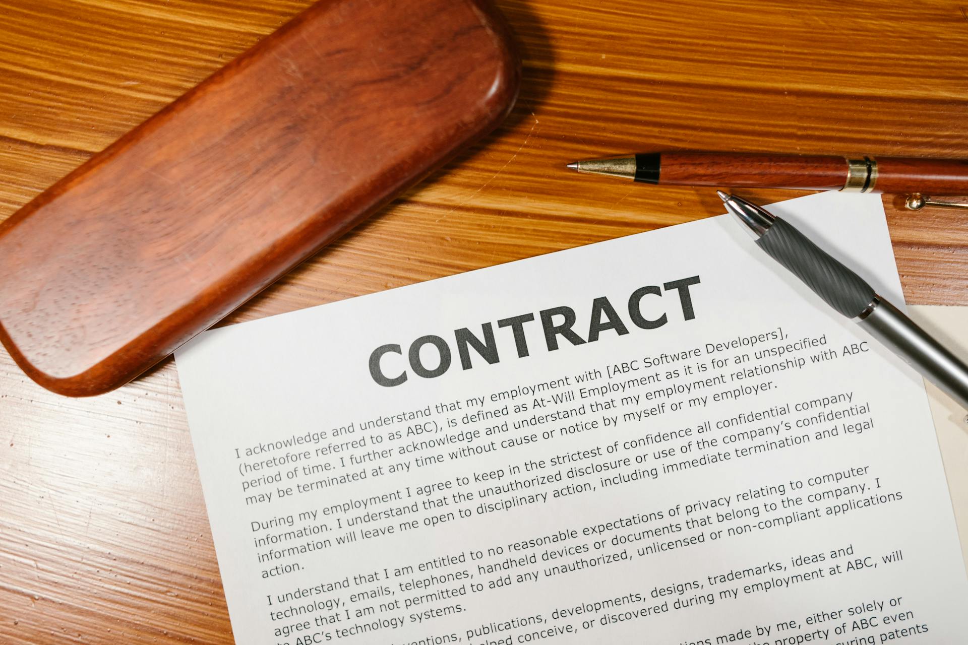 A Contract on Brown Wooden Surface