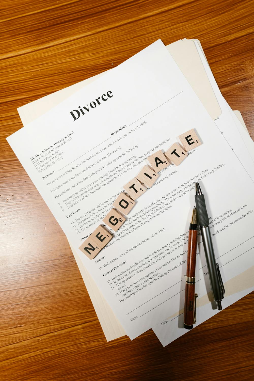 Tiles spelling negotiate on divorce papers