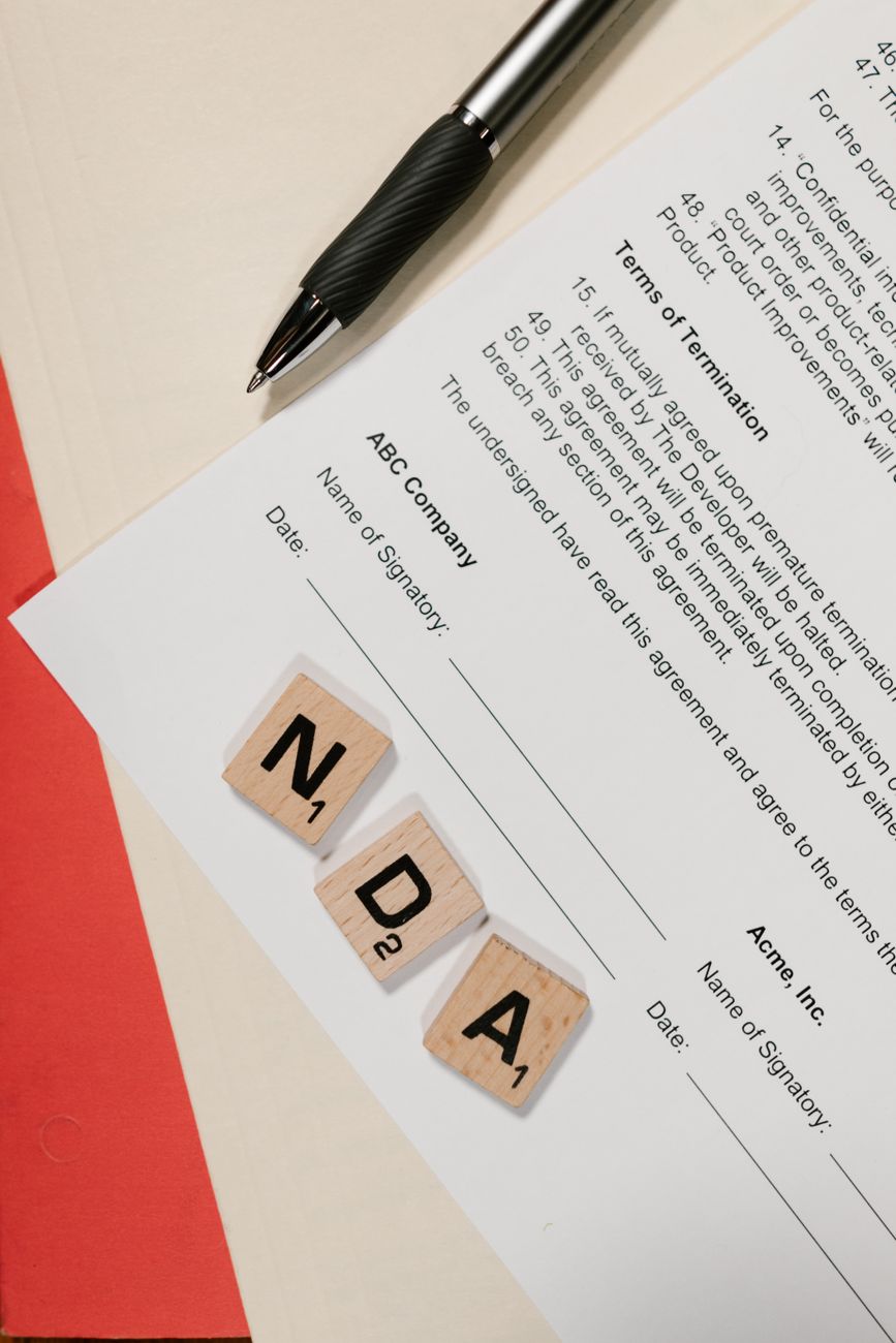 a stack of dependency and license documents on a desk