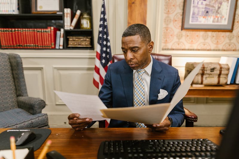 Lawyer reviewing case documents in an office