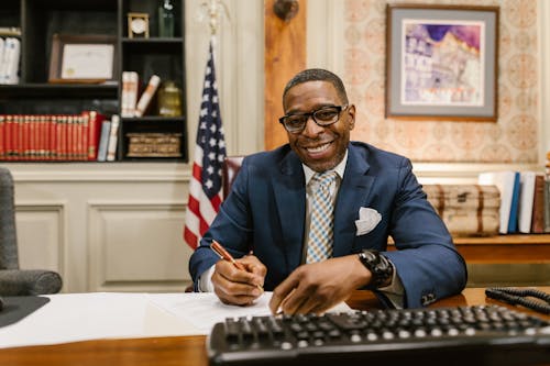 An Attorney in Blue Suit Holding a Pen