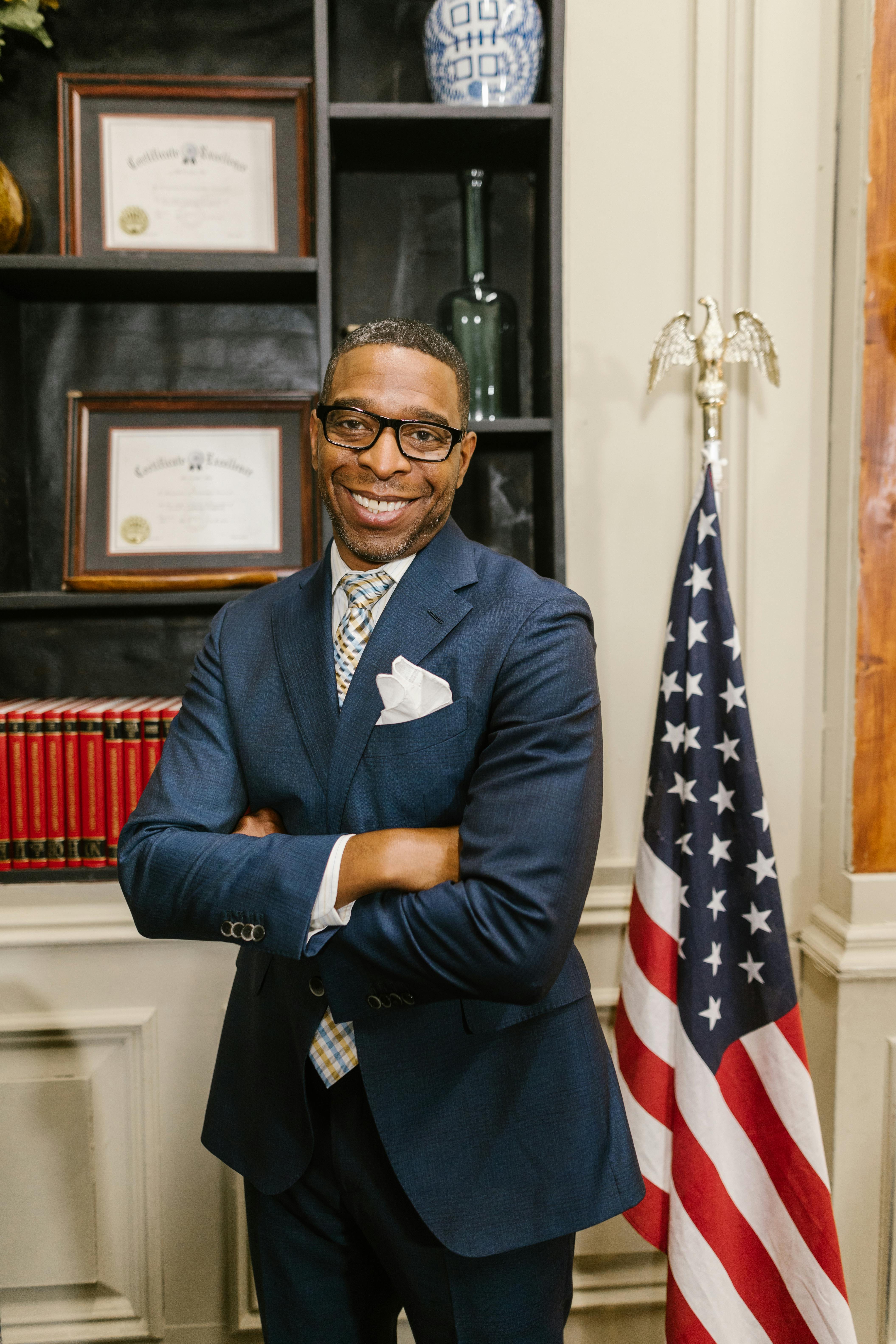 Portrait of a smiling professional man in a law office, embodying confidence and success.