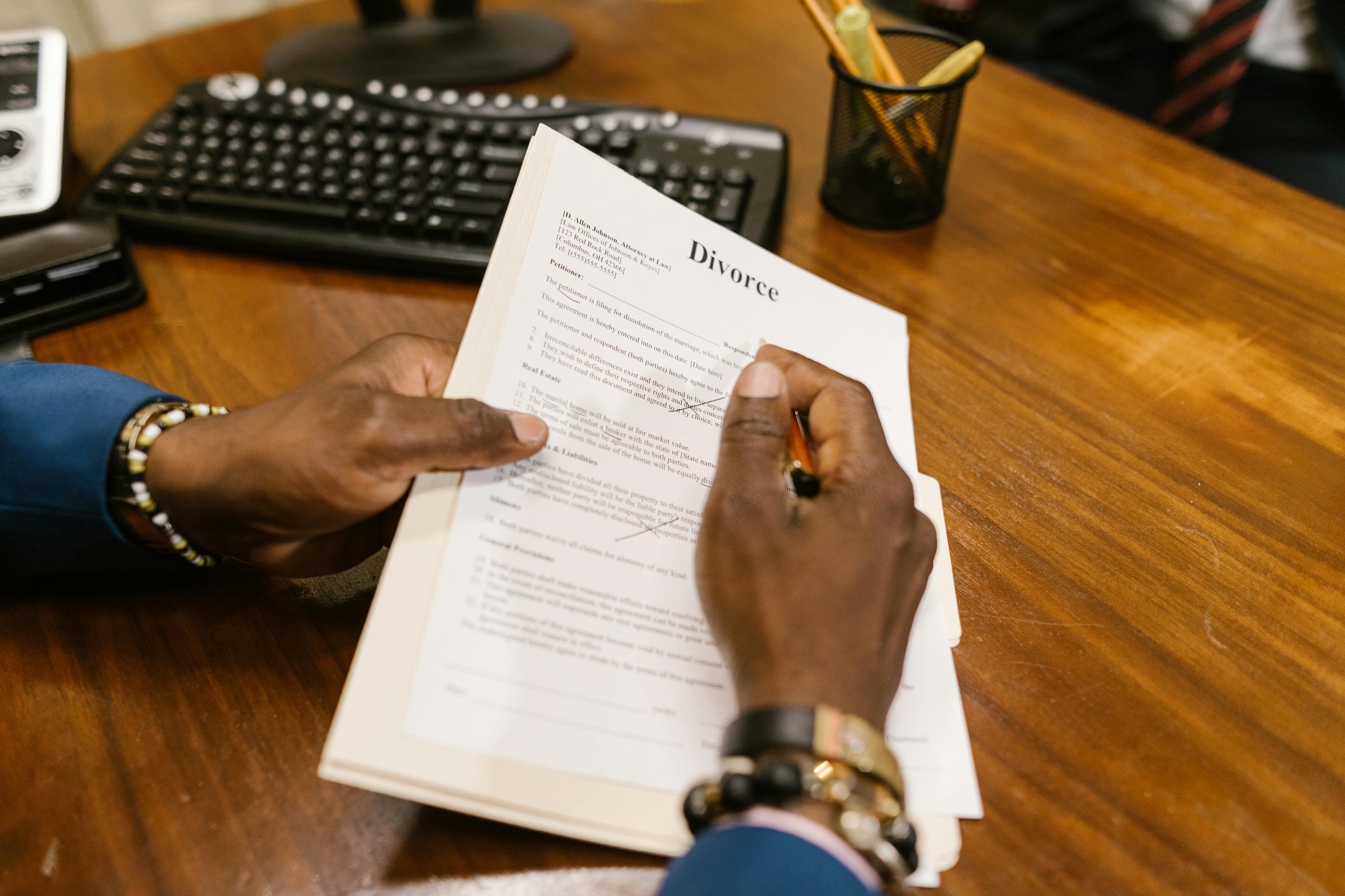 close up shot of a person holding divorce papers