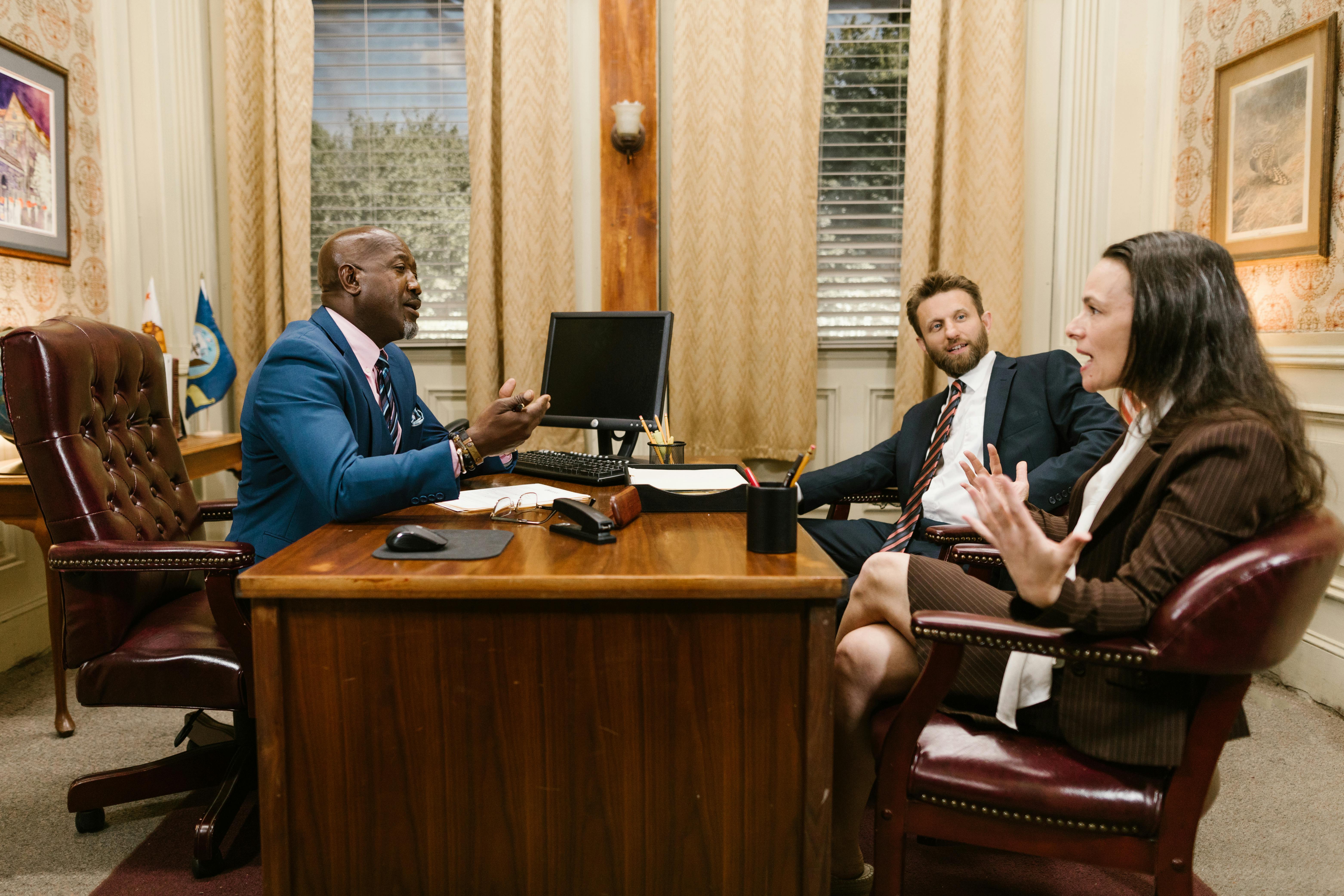 a group people having a meeting inside the office