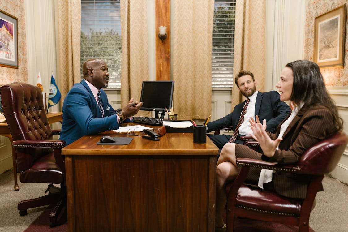 Free A Group People Having a Meeting inside the Office Stock Photo