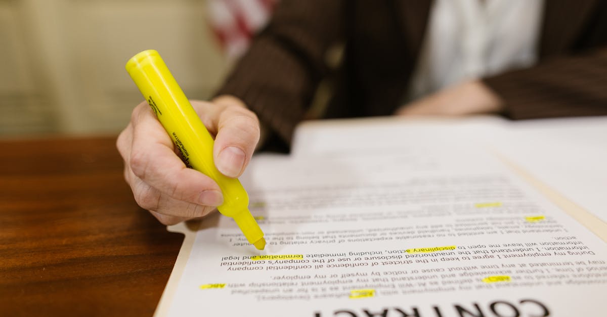 Real Estate Contract Document With Highlighted Sections And A Person Reading It