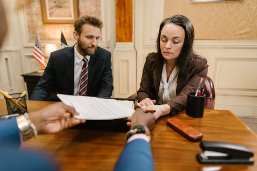 Free Man and Woman Sitting at the Table Stock Photo