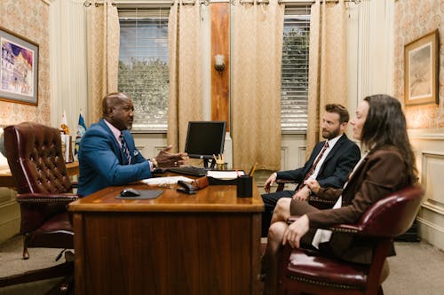 A Group People Having a Meeting inside the Office