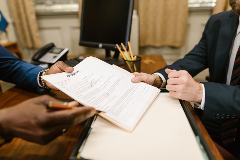 Two people looking at a divorce document