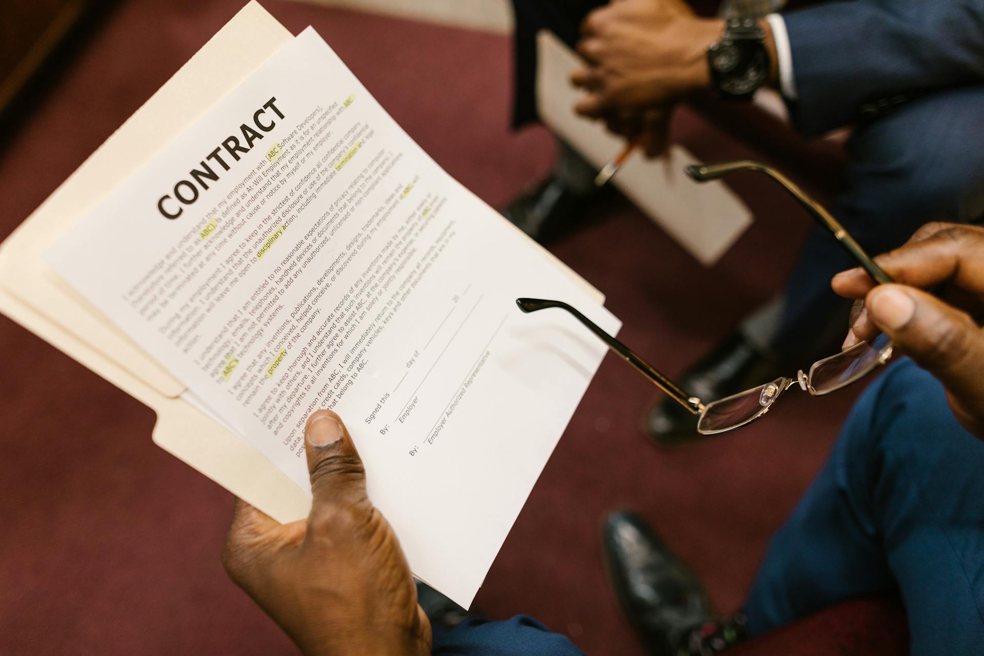 Close-Up Shot of a Person Holding a Contract