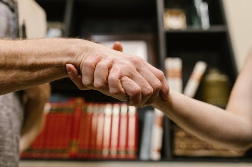 Two People Shaking Hands