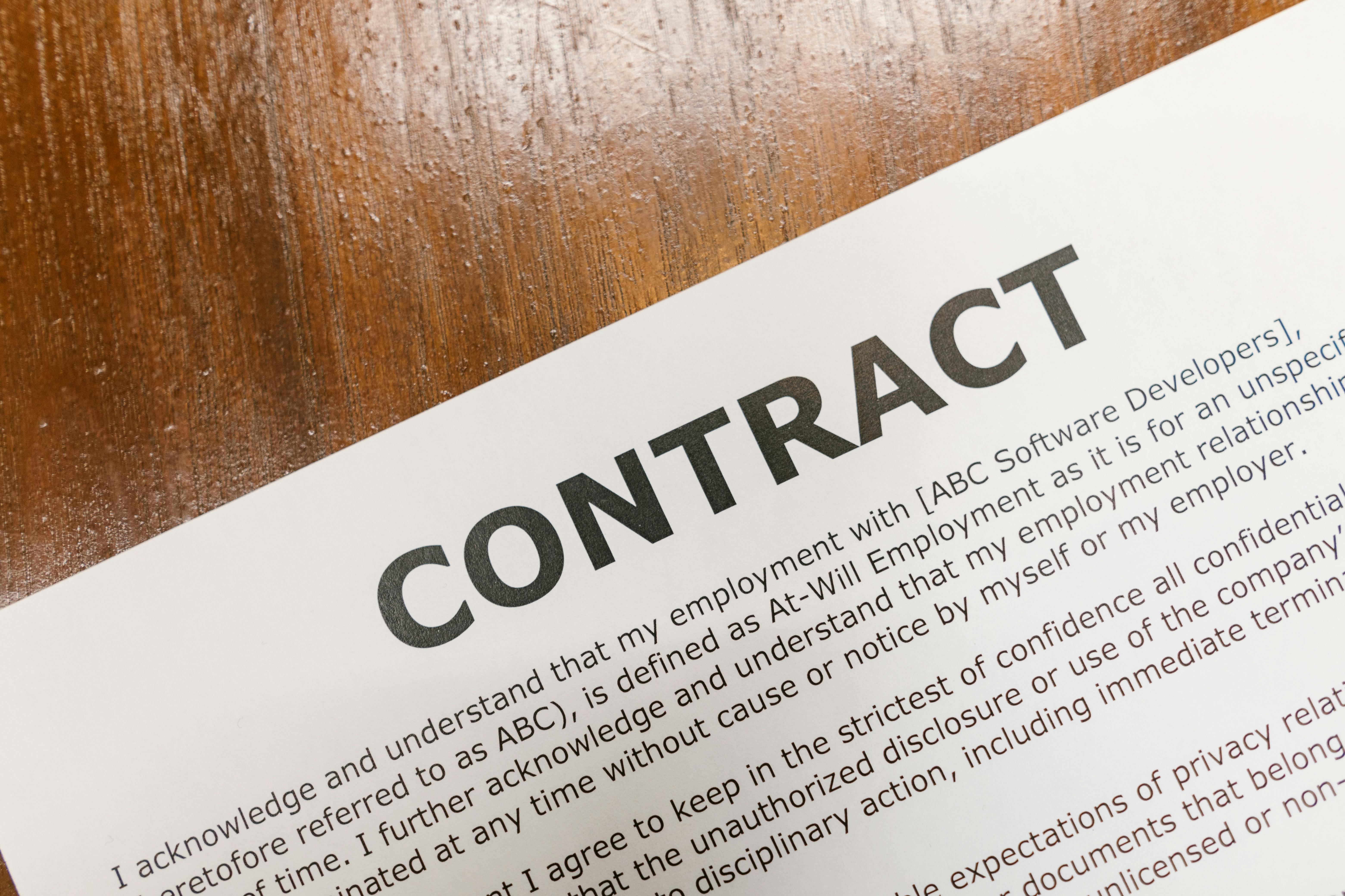 close up shot of a document on a wooden table