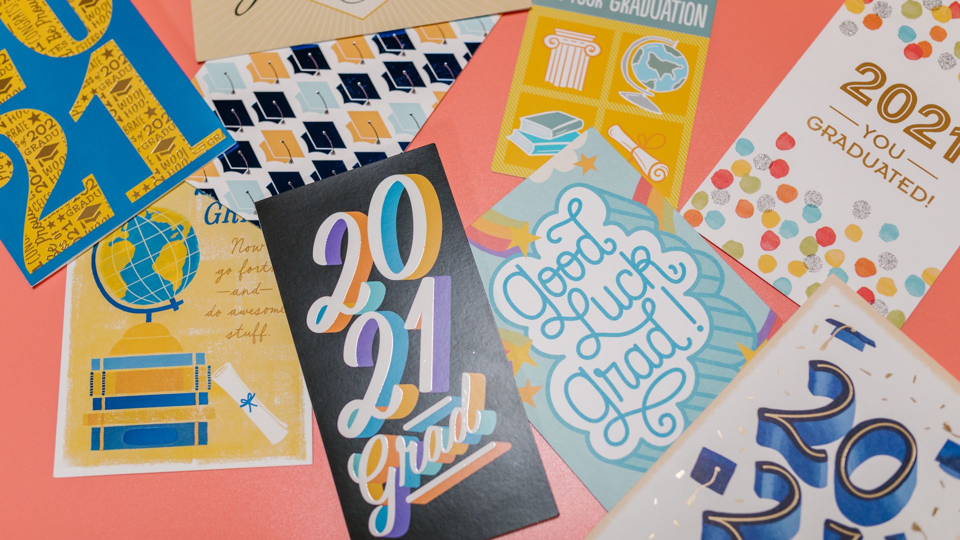 Greeting Cards: Explore the Art of Connection 3 A vibrant spread of 2021 graduation greeting cards in a flat lay.