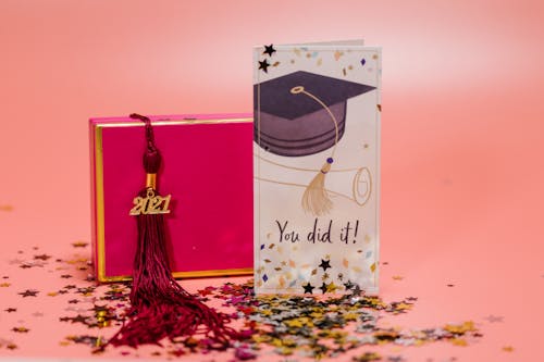 A Graduation Themed Illustration with a Gift Box and a Greeting Card