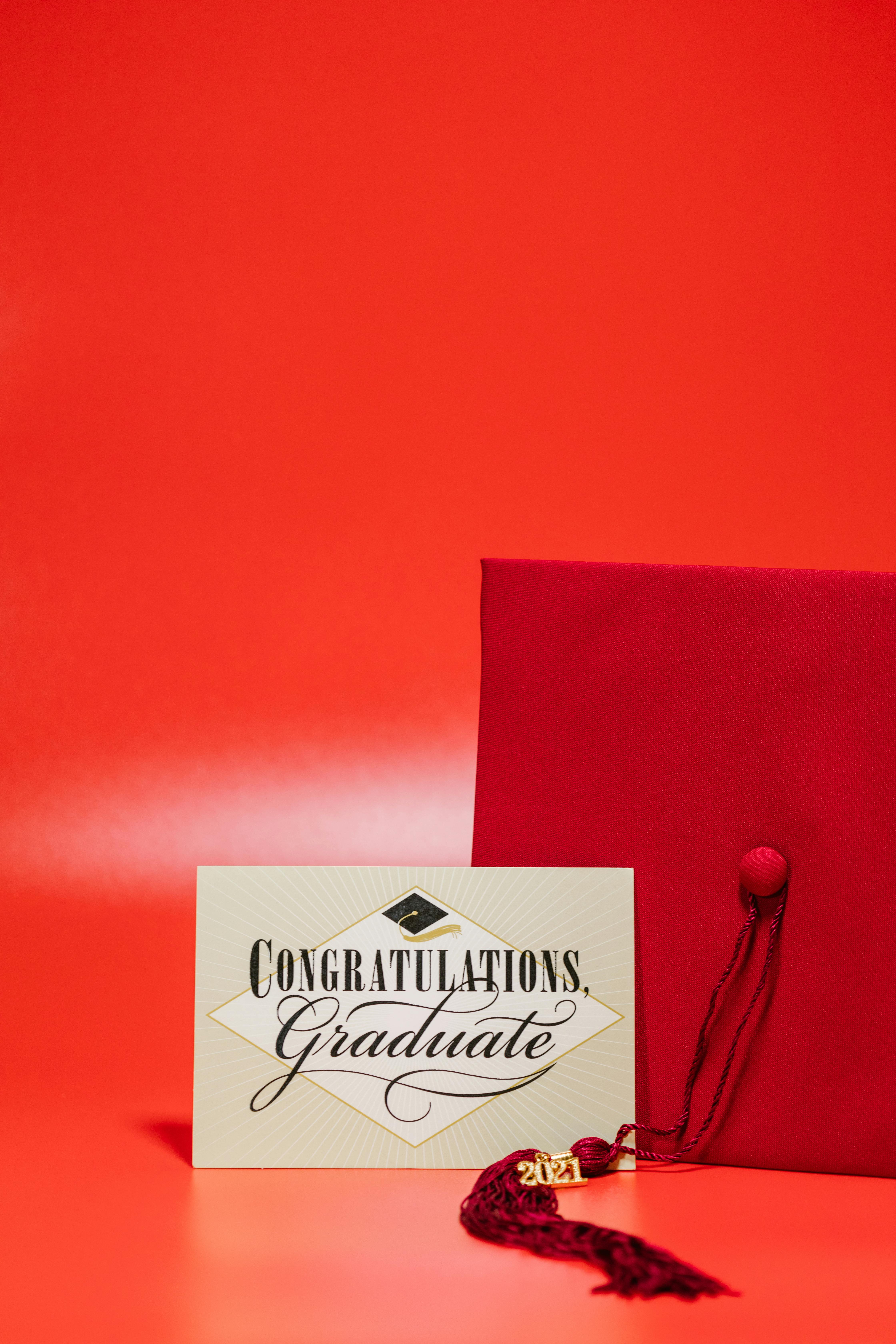 mortarboard with congratulations graduate card