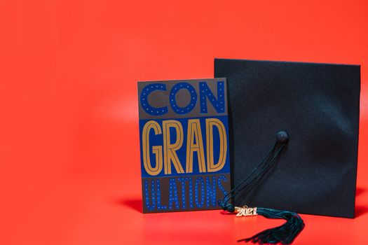 A Greeting Card beside a Square Academic Cap