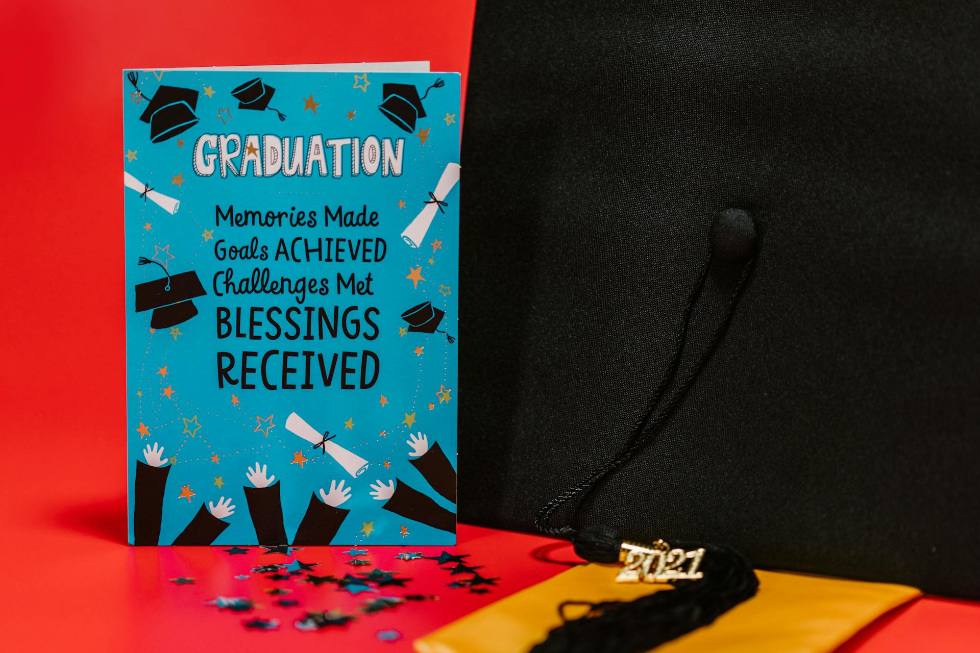 Blue Card with Quote Beside Graduation Cap