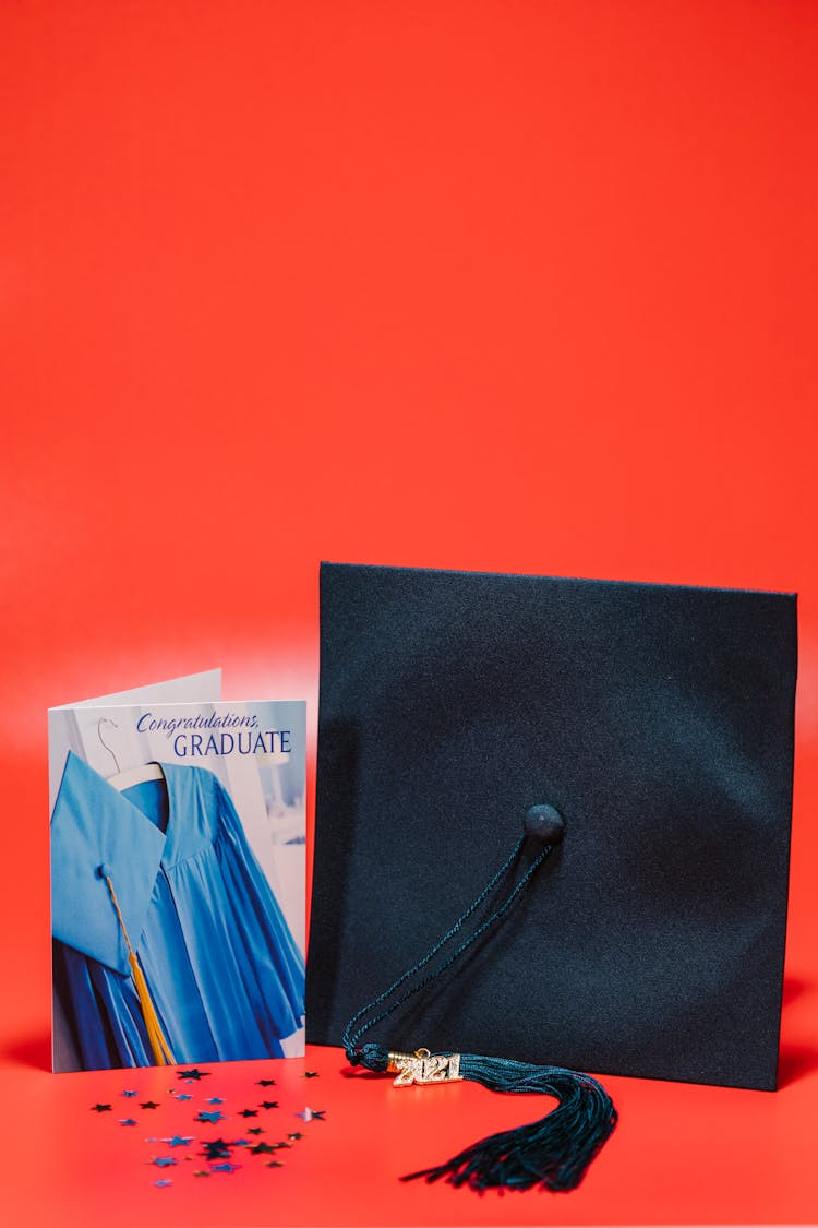 Card Beside Graduation Cap