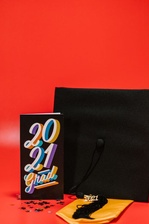 Black Card Beside Graduation Cap Free Stock Photo Black Card Beside Graduation Cap Free Stock Photo