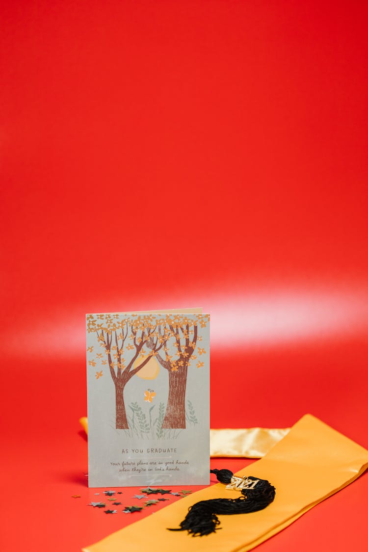 A Greeting Card Beside A 2021 Tassel