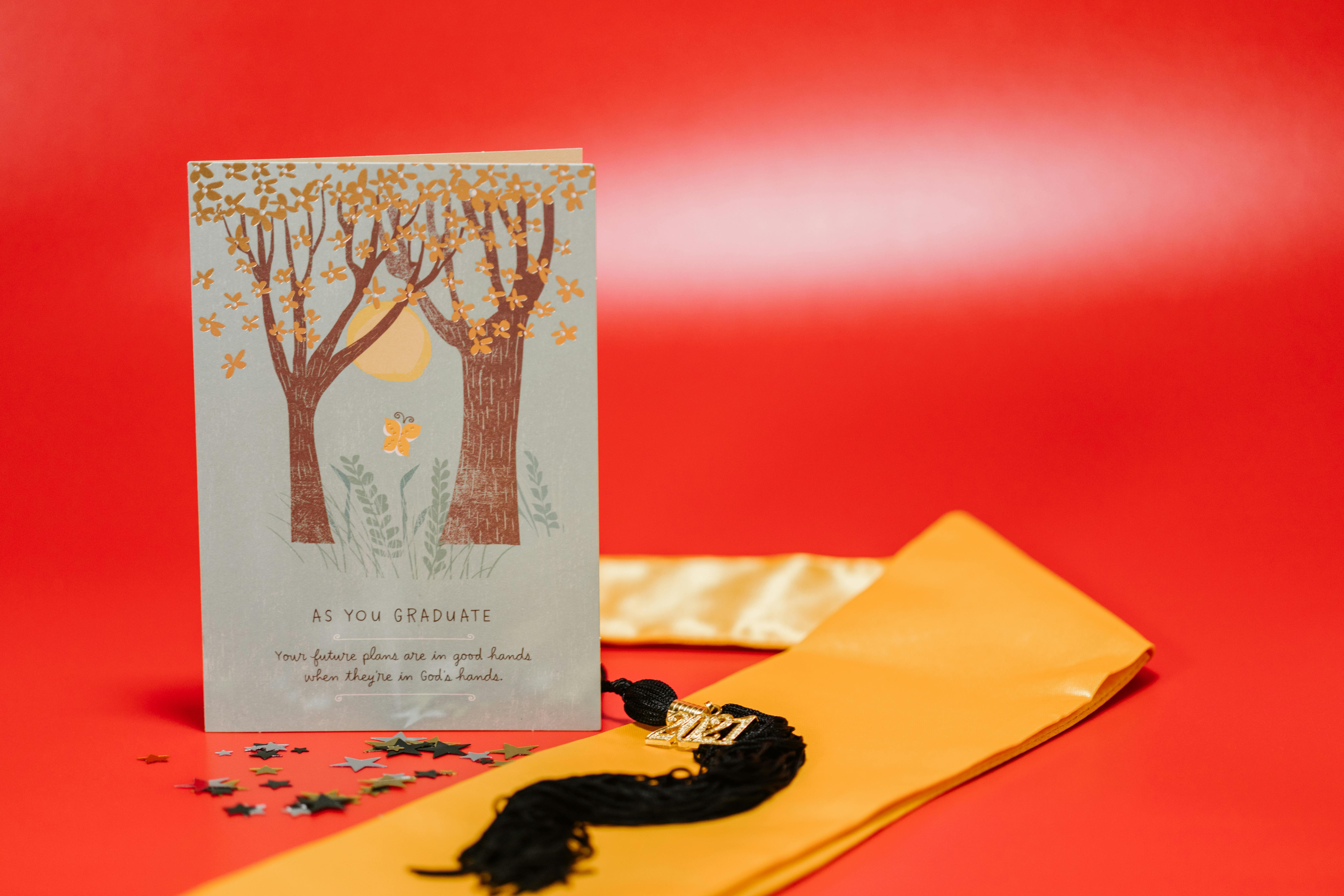 graduation greeting card on red surface