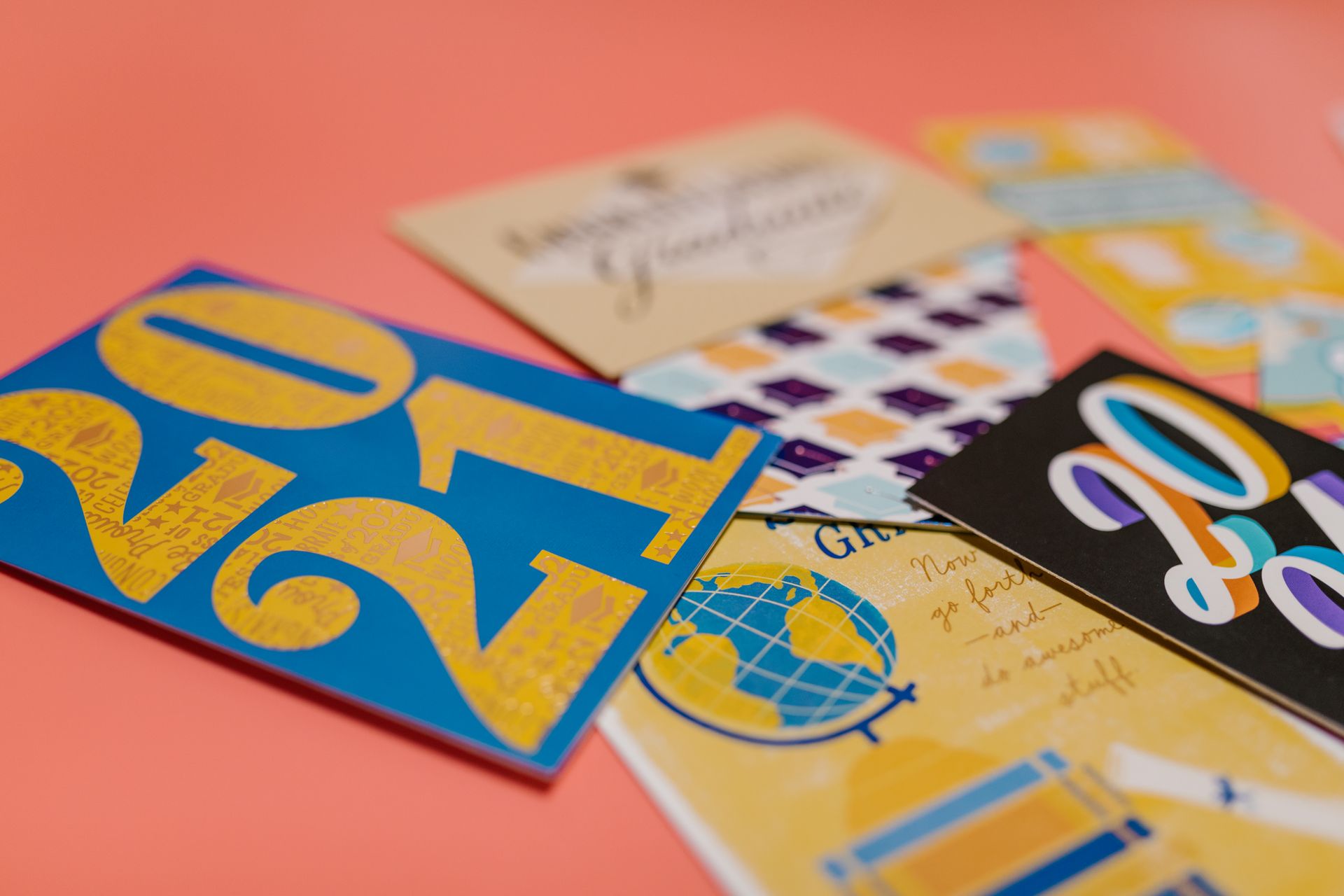 Colorful greeting cards with 2021 design on a peach background.