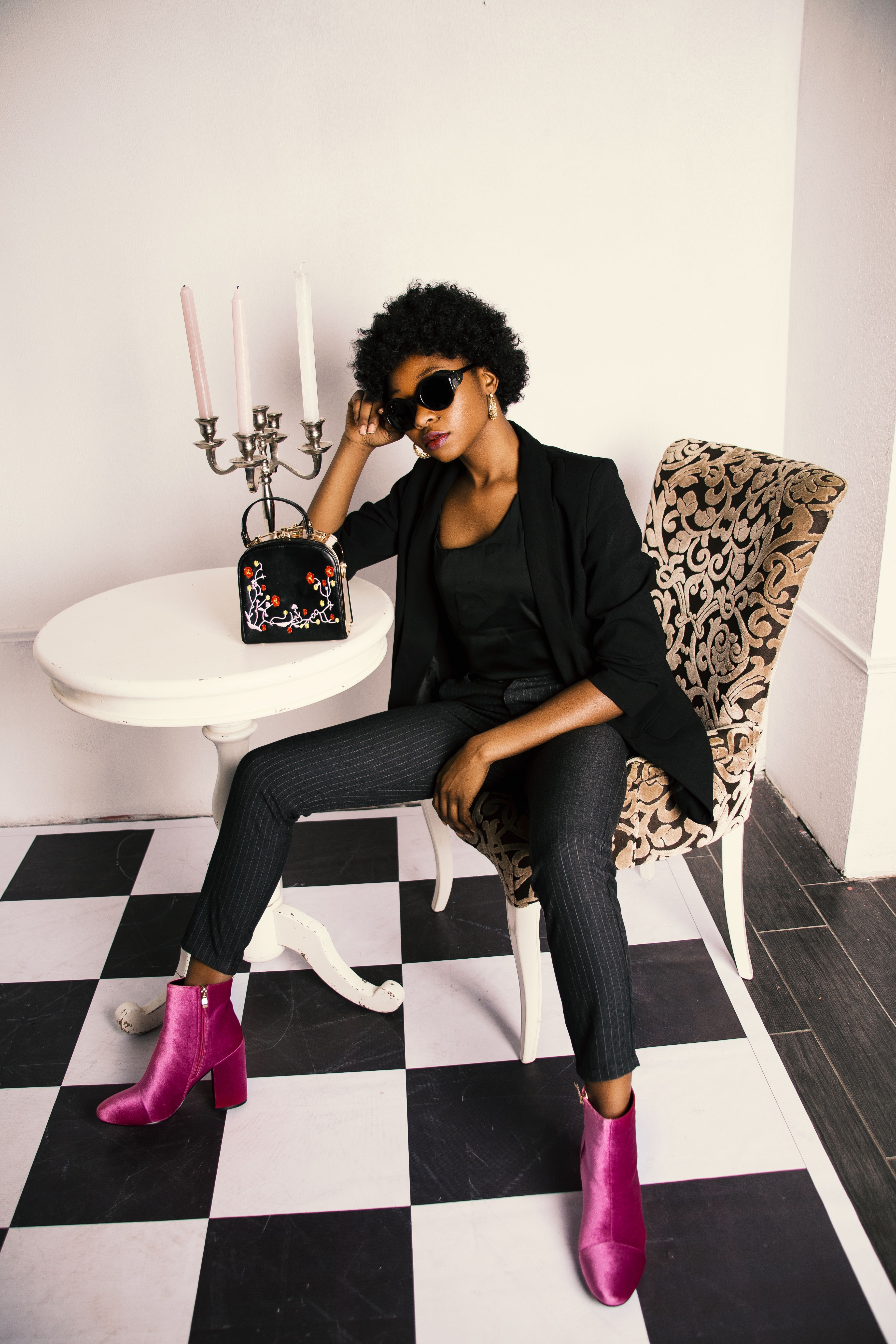 Woman in Black Shirt and Blazer Sitting on White and Brown Wooden Chair ...