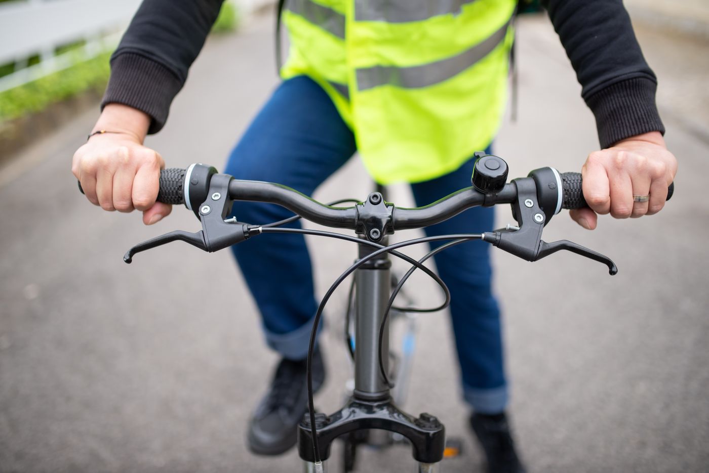 Rider's hands on the handlebars of a city bike — photo by Kampus Production on Pexels