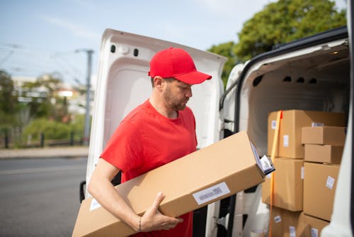 Gratis arkivbilde med bokser, deliveryman, frakte