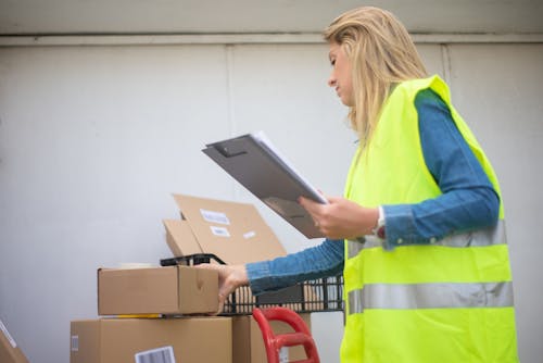 Free A Woman Holding a Clipboard Stock Photo