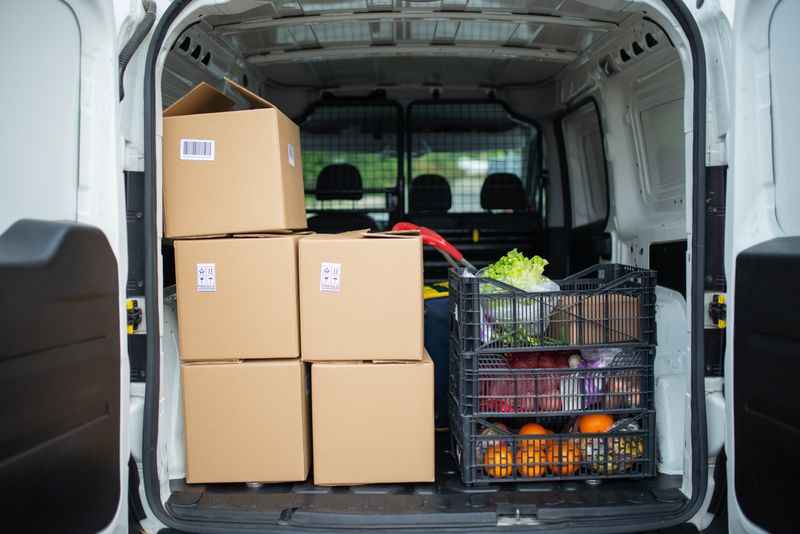 Delivery van loaded with fresh produce crates