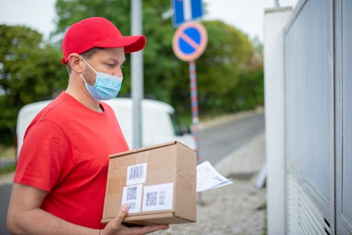A Delivery Man Holding a Parcel