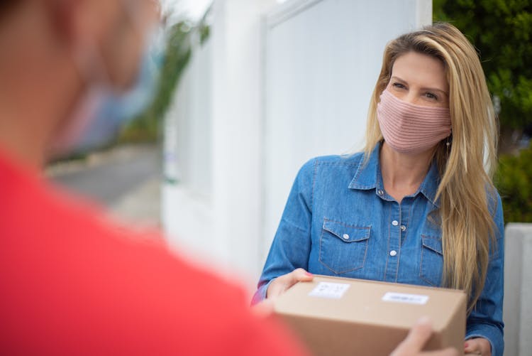 A Woman Receiving A Package