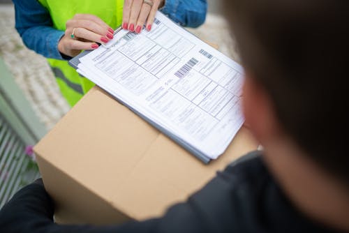 Free Person Receiving a Package Stock Photo