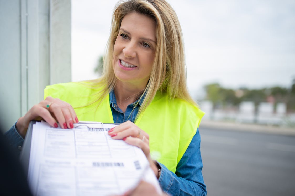 Free Photo of a Woman Holding Documents Stock Photo