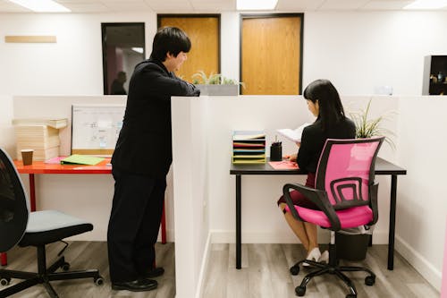 A Man and a Woman Working Inside an Office