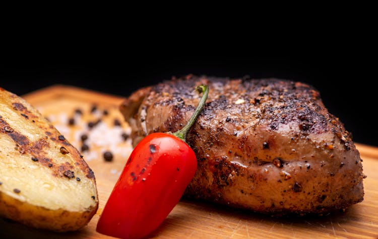 Beef Steak And Potato On Board