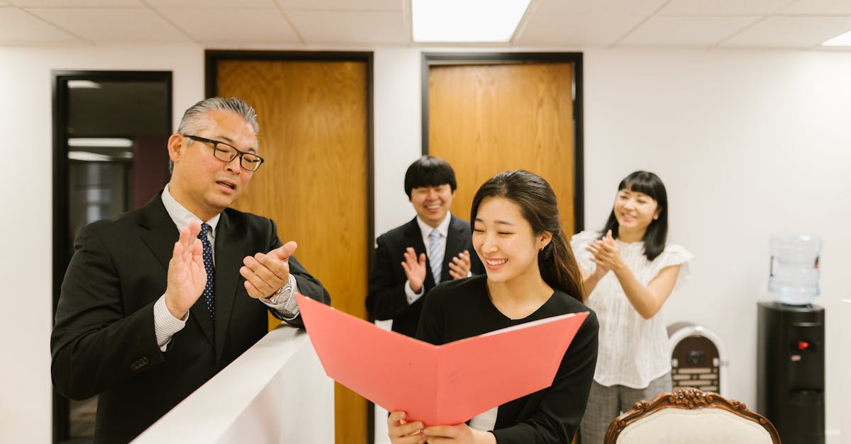 Office Environment With A Team Celebrating A Project Completion, Showing A Lack Of Recognition Or Acknowledgment From A Manager