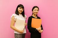 Woman in White Shirt Holding White Paper
