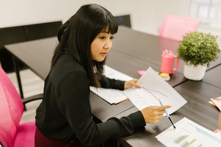 entrepreneur reviewing business chart office
