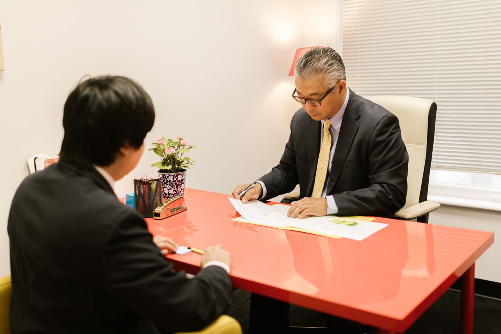 Two professionals reviewing a printed performance report together