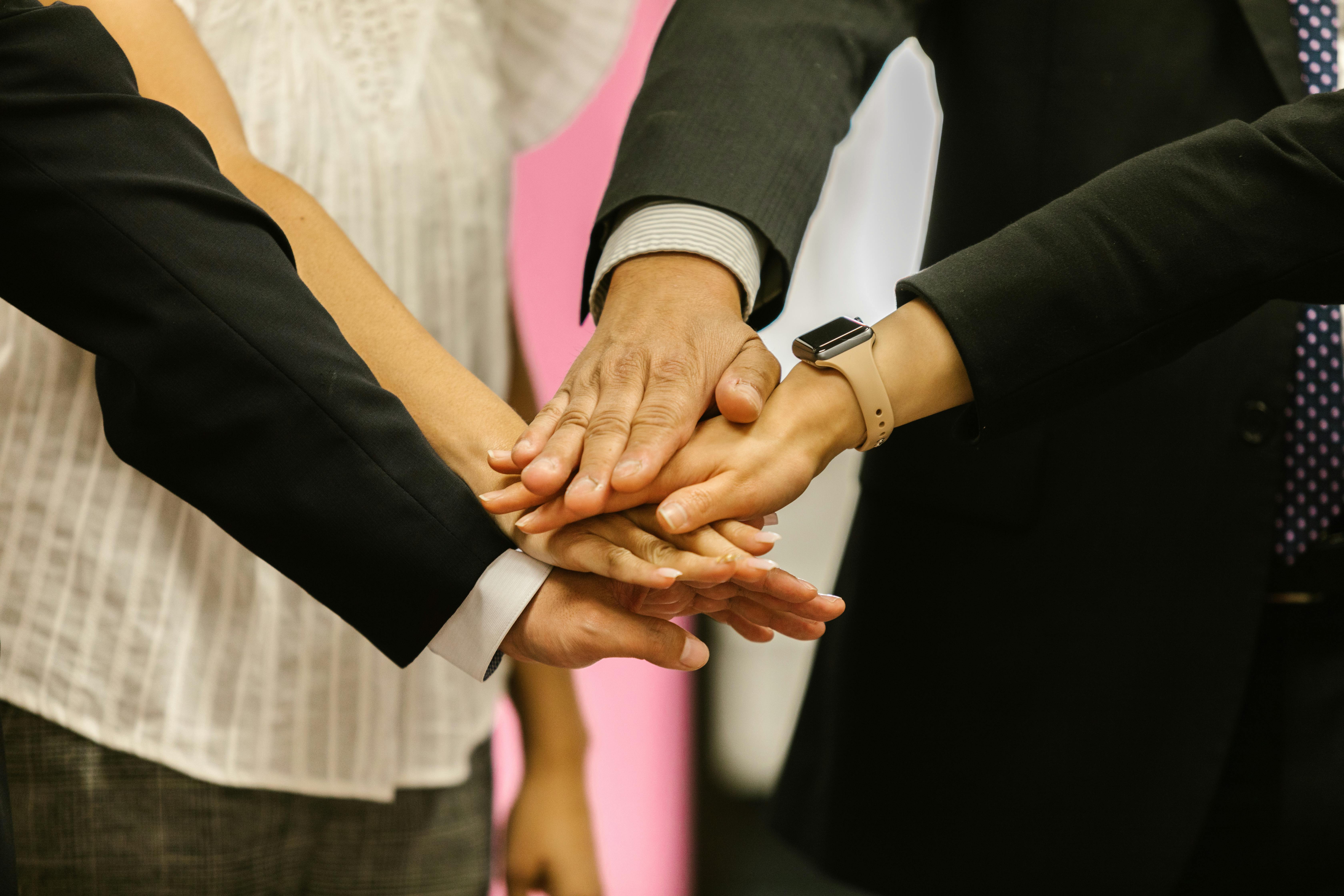 workmates in a team huddle